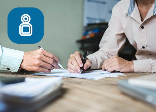 Two business professionals looking at a document 