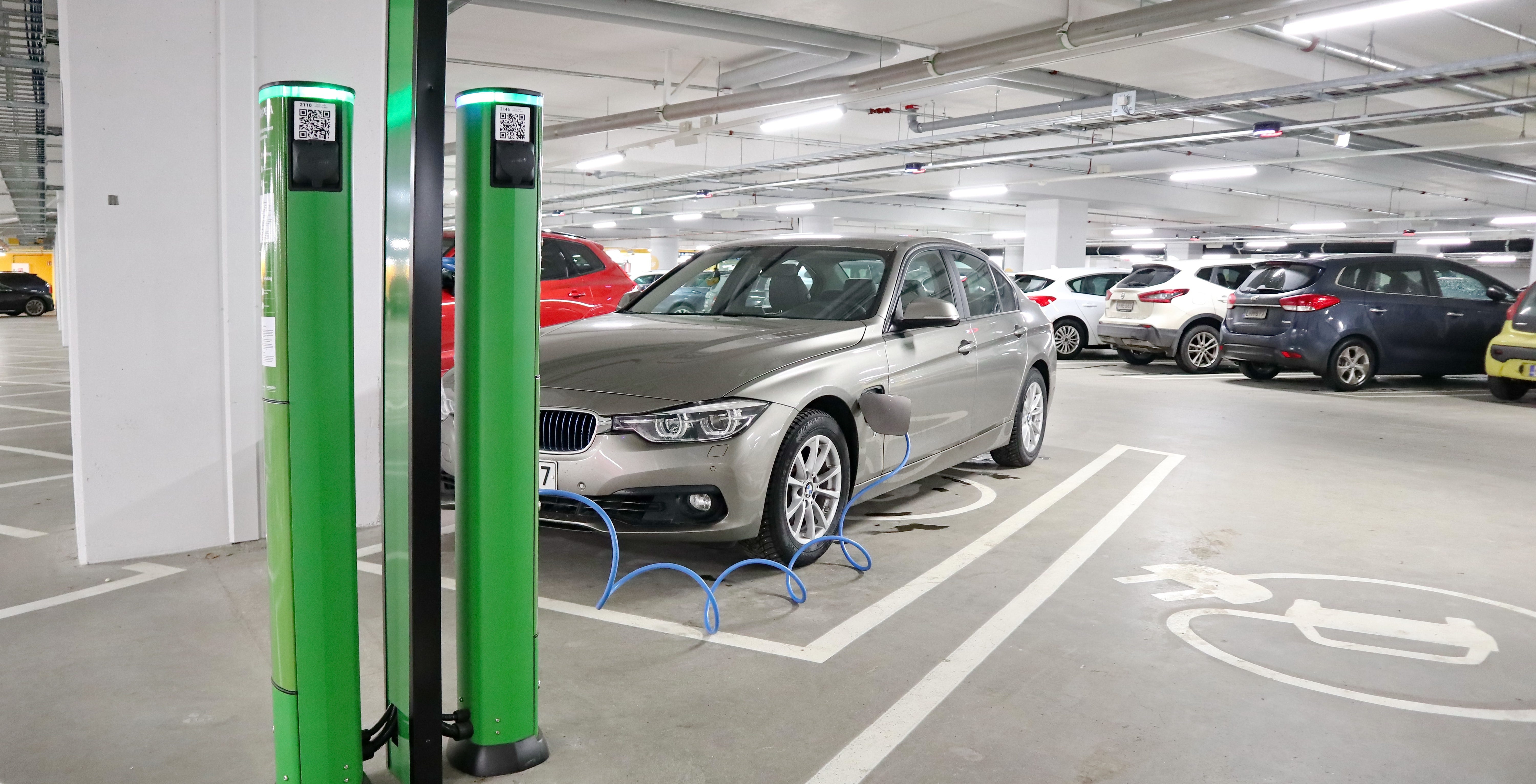 Electric car charging in a car park